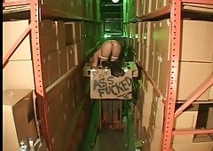 Cute prostitute in boots dped in a warehouse