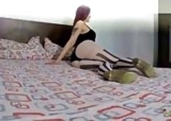 Sexy Redhead Flaunts Black Bodysuit and Patterned Pantyhose